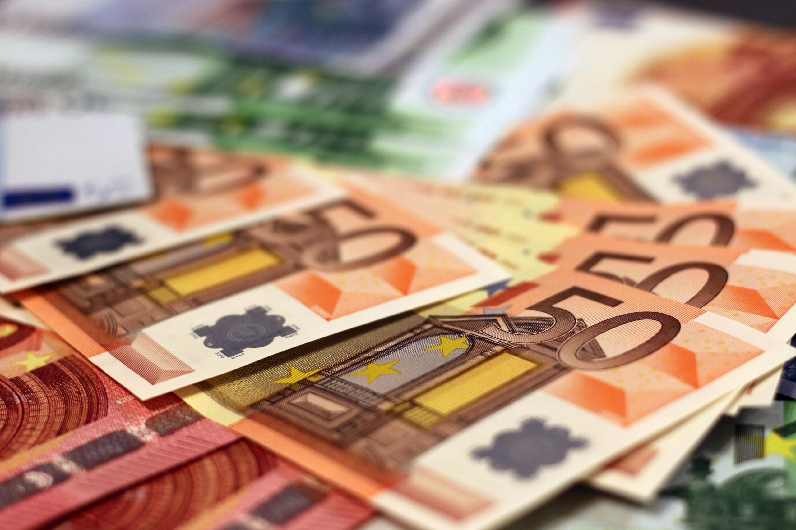 Stack of 50 euro banknotes, representing wealth and finance concepts.